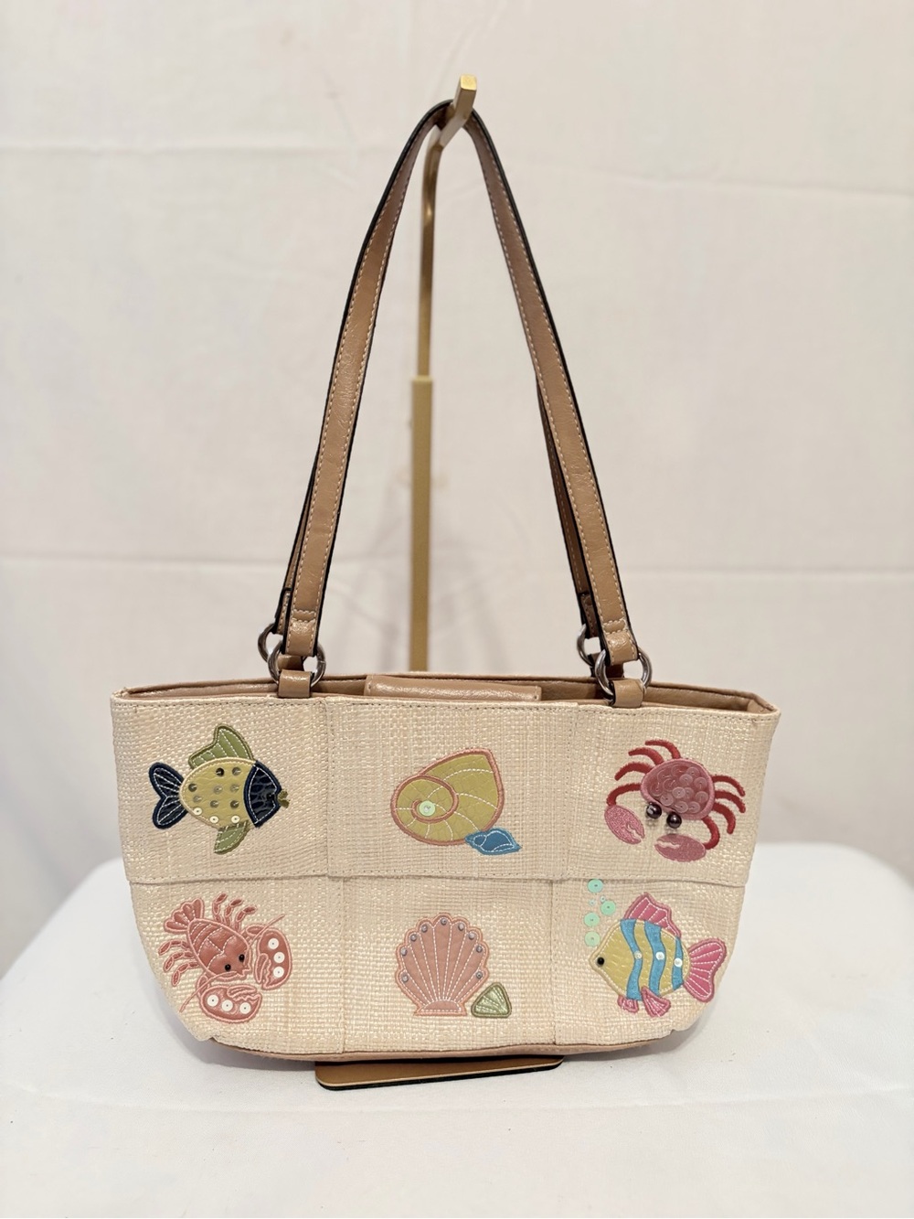 beige woven beach theme shoulder handbag from Rosetti.